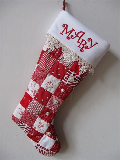 A Red And White Christmas Stocking Hanging On A Wall