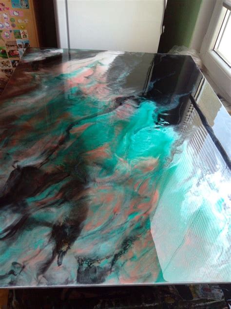 It's fun to press trinkets and items into jewelry resin clay. Unique colors for a resin painting. Beautiful. Teal blue ...