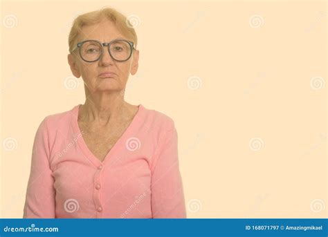 Studio Shot Of Senior Nerd Woman Wearing Geeky Eyeglasses Stock Image