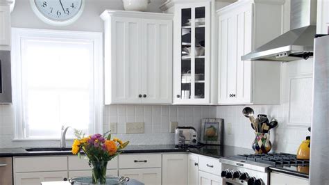 Prime any interior kitchen cabinet surfaces to be painted first. Painting Kitchen Cabinets in 6 Steps | Blue backsplash ...