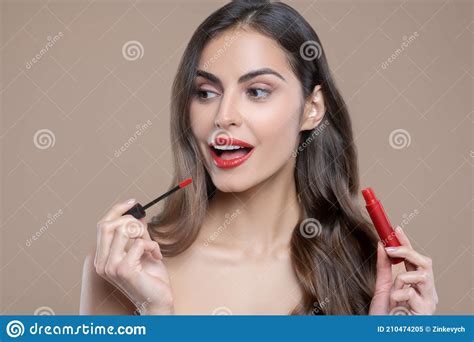 Long Haired Woman Painting Lips With Red Gloss Stock Image Image Of Longhaired Indoors 210474205