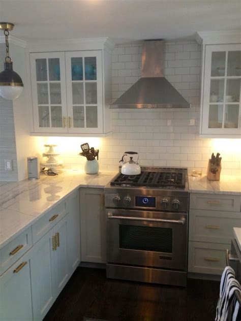 How much does it cost to open a subway franchise? open cabinets, range with hood, subway tile backsplash ...