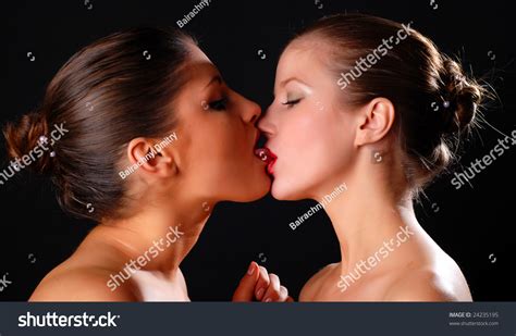 Two Beautiful Women Kissing At Black Background Stock Photo 24235195