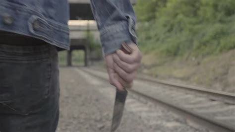 Maniac With A Knife Near The Railway Tracks By Sunstock On Envato