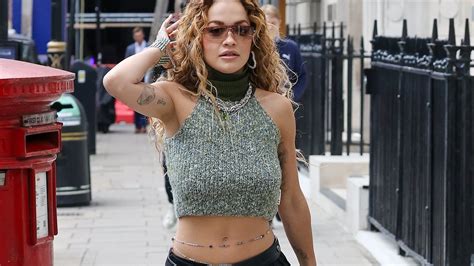 Rita Ora Shows Off Her Washboard Abs In A Green Halterneck Crop Top As