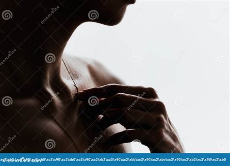 Dark Silhouette Of A Girl With A Beautiful Collarbone On A White