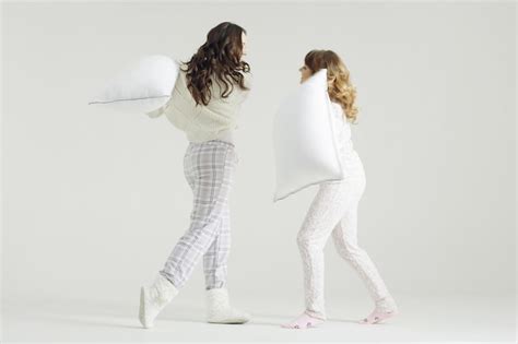 Premium Photo Girl Fight Pillows Pajama Party