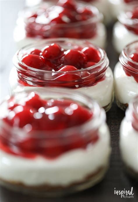 Small Jars Filled With Red And White Desserts