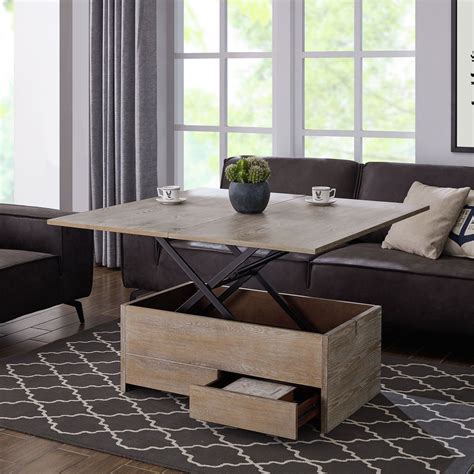 This particular coffee table is designed by tom rossau and can be used as well as in modern as traditional interior design. Southern Enterprises Ardsley Convertible Storage Coffee ...