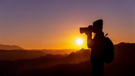 Young Woman Photographer Taking Photo With Sunset On Mountain Natural