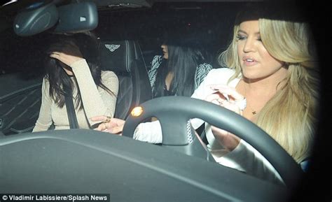 Khloe Kardashians Tight White Dress Has A Tear In The Back As She