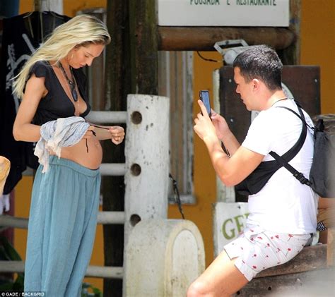 Pregnant Candice Swanepoel Cradles Bump On The Beach Daily Mail Online