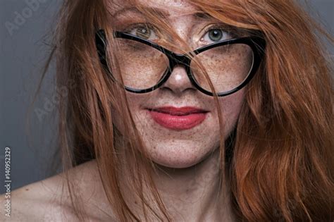 portrait of a redhead freckled girl in glasses immagini e fotografie royalty free su fotolia