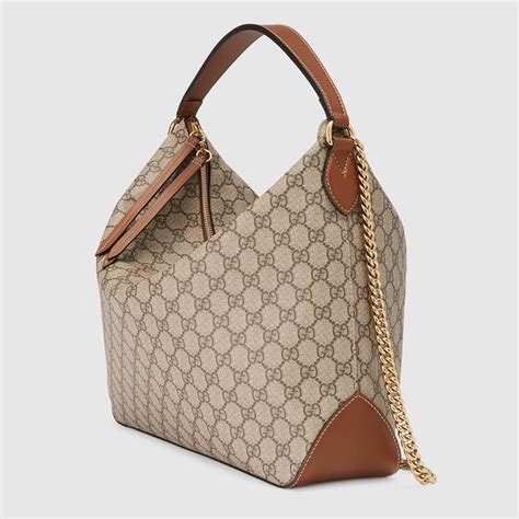 Shop The Gg Supreme Large Hobo By Gucci A Large Hobo With An Attached