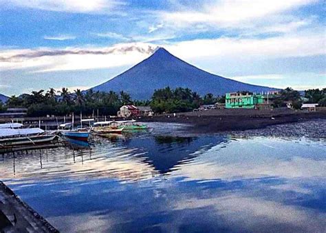 The Reflection Of The Mayon Volcano Photograph By William E Rogers