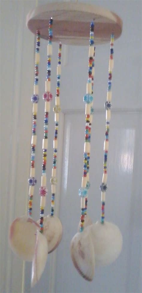 Use small shells for the fins, and add a plastic eye. Clam shell Chimes (With images) | Chimes, Sea shell decor ...