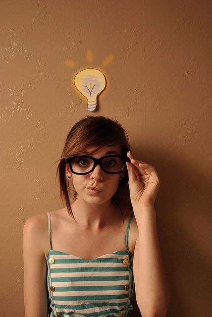 nerdy girl with glasses and green stripy dress with lightbulb idea nerdy girl nerdy glasses