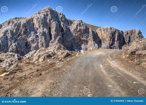 Mountain Road Passing Rugged Rocky Cliffs Stock Image Image Of