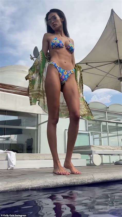 Kelly Gale Flaunts Her Ample Cleavage In A Tiny Floral G String Bikini
