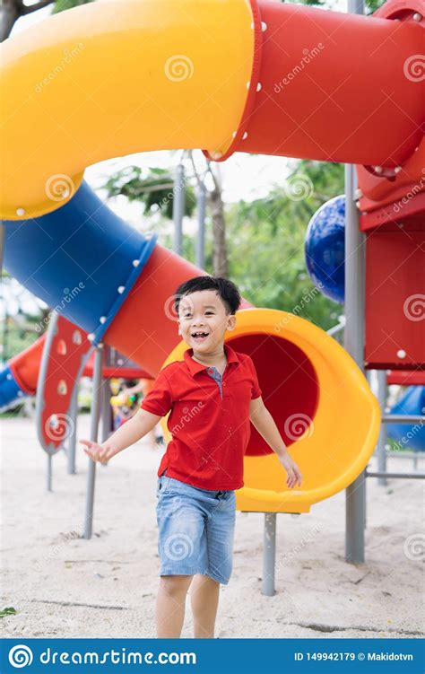 Children Playing On Playground In Summer Outdoor Park Stock Image