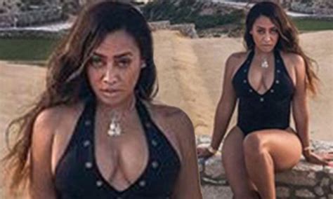 La La Anthony Flashes Her Cleavage In A Plunging Swimsuit Daily Mail