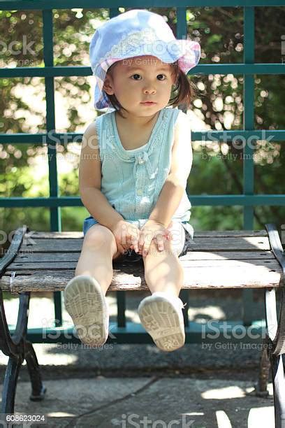 Japanese Girl Sitting On The Bench Stock Photo Download Image Now