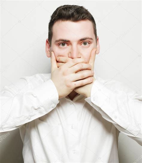 Shocked Young Man Covering Mouth With Hands — Stock Photo © Kanareva