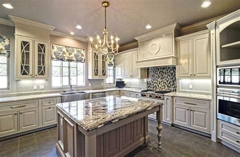 You can pair antique white kitchen cabinets with a lot of other details and elements to create specific looks that will, of course, give kitchen cabinets and granite black granite countertops kitchen hoods cream cabinets brown granite kitchen flooring antique white cabinets antique kitchen. 30 Antique White Kitchen Cabinets (Design Photos ...