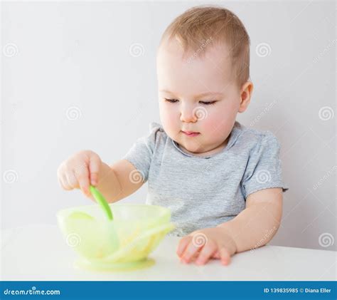 Portrait Of Cute Baby Girl Eating Porridge Stock Image Image Of Eats