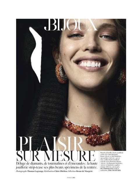 A Woman Is Smiling And Wearing Jewelry On The Cover Of An Article In