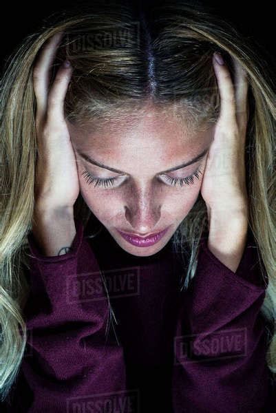 Woman Holding Hands Over Ears Stock Photo Dissolve