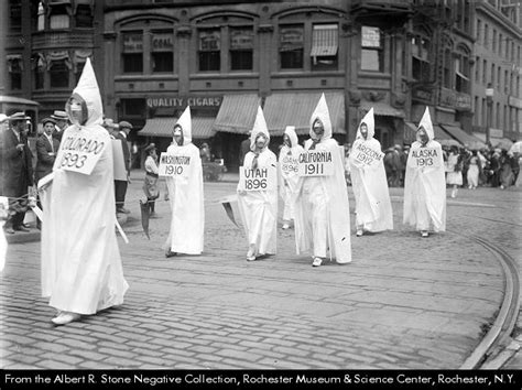 Suffragists Wearing White Robes March In A Parade In Rochester Ny