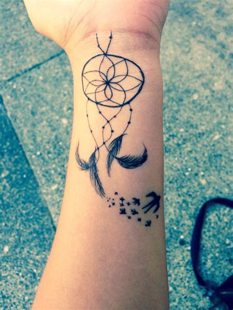 Girl With A Dreamcatcher And Birds Tattoo On Her Wrist Tattoos On Wrist