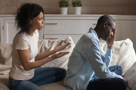 Stressed Young African Ethnicity Woman Apologizing To Offended Husband