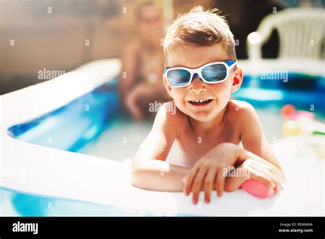 Happy Boy Enjoying Summer Time In Swimming Pool Stock Photo Alamy