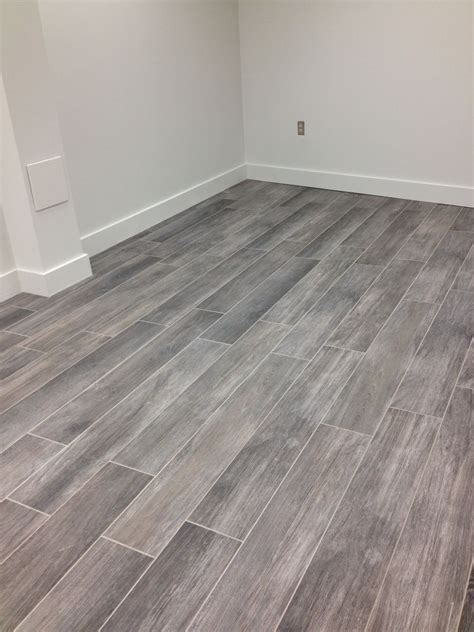 In addition, the slick surface finishes of most tiles should be roughed up to accept an adhesive bond. Porcelain grey wood tile | Gray wood tile flooring, Grey ...