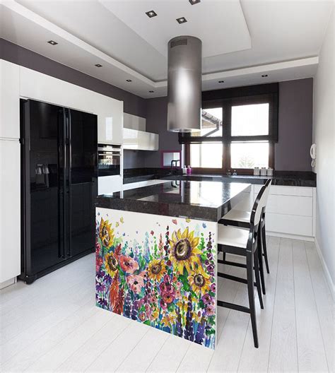 A Kitchen With An Island Painted With Sunflowers On The Counter And