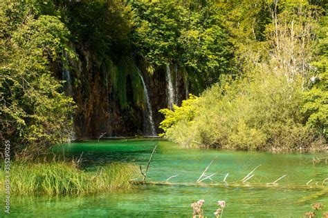 Landscape Of Waterfall And Turquoise Lake In The Forest Plitvice Lakes