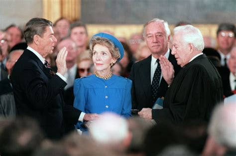 President Reagan Taking The Oath Of Office In The Capitol Rotunda While Mrs Reagan Holds A