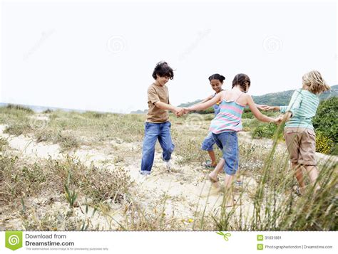 Friends Playing Ring Around The Rosy Stock Image Image 31831881