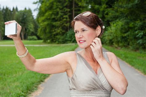 Woman In Gown Taking Self Portrait With Cell Phone Stock Image Image Of Attractive Phone