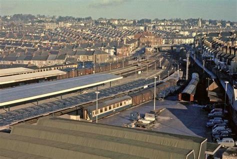 An Aerial View Of A Train Station With Trains On The Tracks And