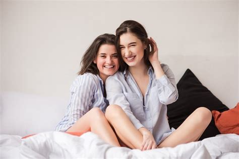 Premium Photo Two Attractive Women Hugging In Bed