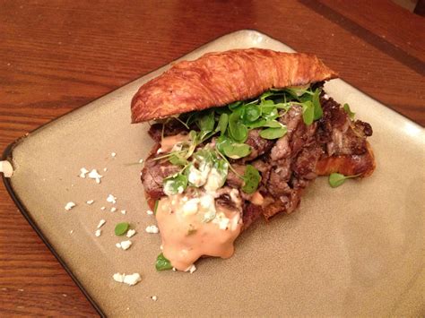 beef tenderloin on a toasted croissant with feta water cress and homemade thousand island
