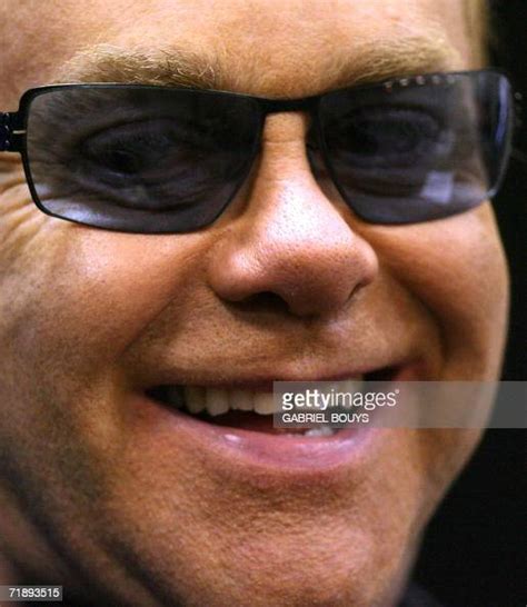 British Pop Star Sir Elton John Smiles During A Press Conference