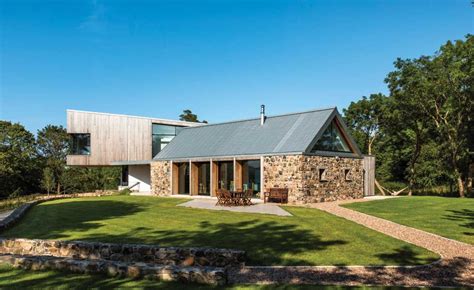 A Pairing Of A Dramatic Cantilevered Extension And Stone Barn Brings A