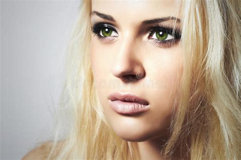 Beautiful Face Of Young Womanblond Girlsad Woman With Green Eyes