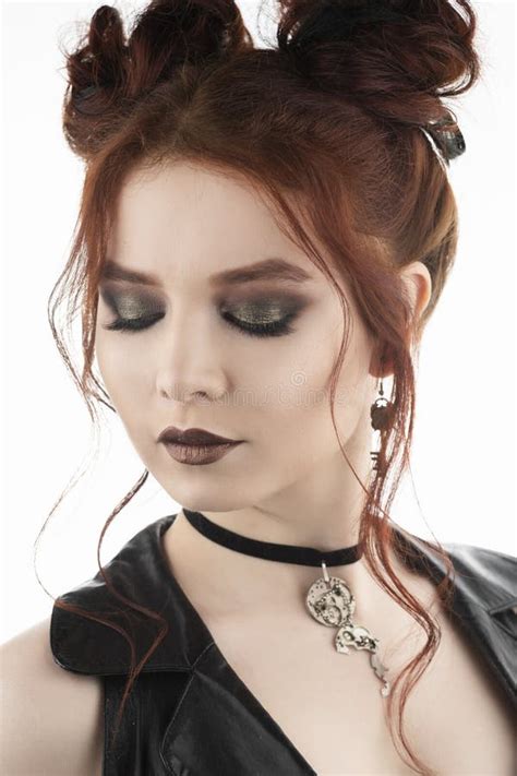 A Beautiful Redhead Cosplayer Girl Wearing A Victorian Style Steampunk