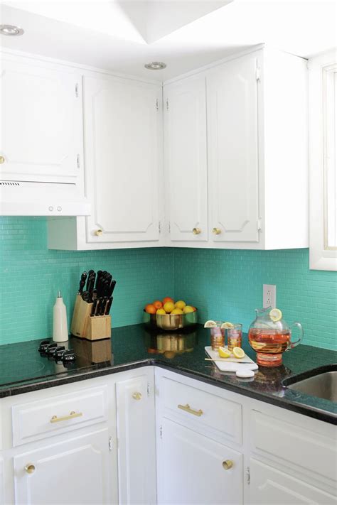 Paint your backsplash with general finishes milk paint in the color of your choosing (we mixed the snow white color with a little bit of antique white). How to Paint a Tile Backsplash! - A Beautiful Mess