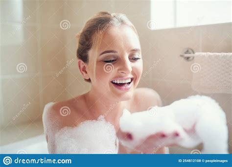 Bubble Baths Are My Perfect Kind Of Stress Reliever An Attractive Young Woman Relaxing In The